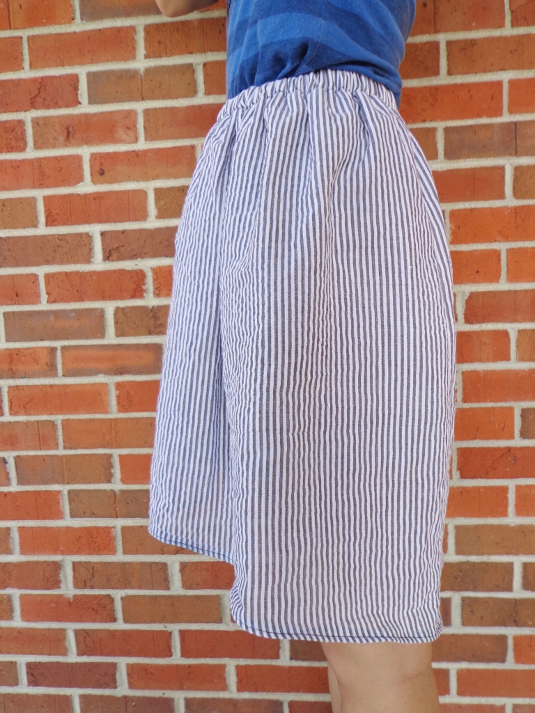 Close side view of seersucker skirt with hi low hem. Handmade by Conniya